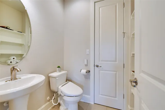 a bathroom with a sink and toilet