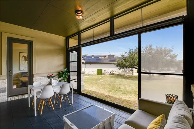 a view of a living room and dining area with furniture