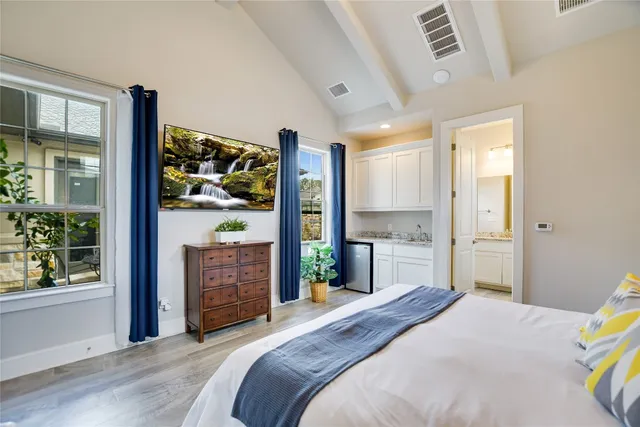 a bedroom with a bed and a dresser