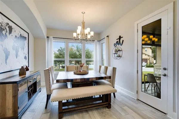 a bedroom with furniture and a chandelier