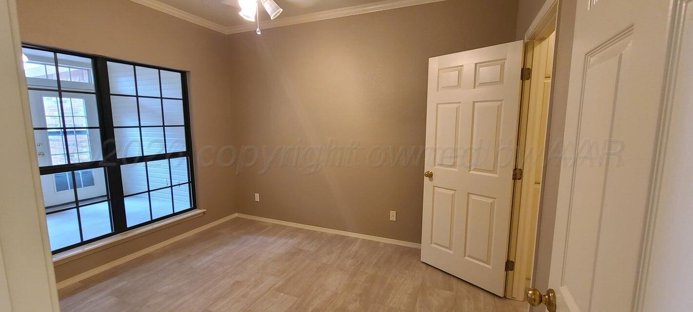 3531 West Point Drive Amarillo, TX 79119 - Photo 9 of 12 wooden floor and windows in a room