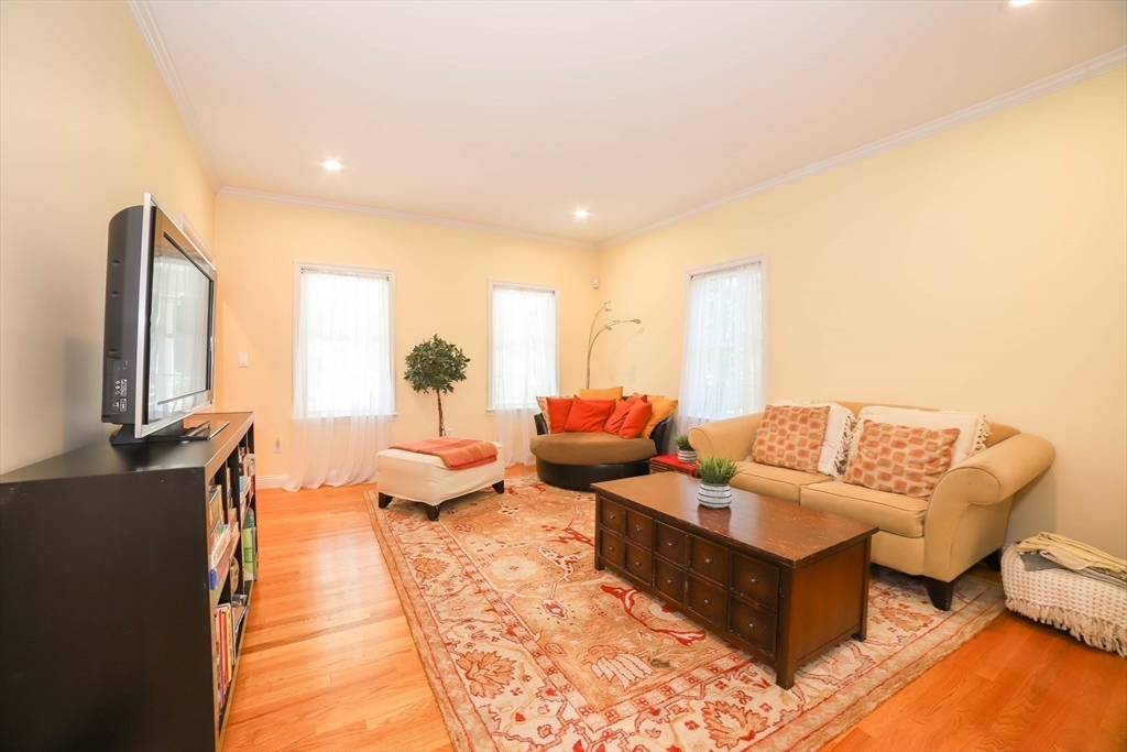12 Springs Road Billerica, MA 01821 - Photo 12 of 40 a living room with furniture and a flat screen tv