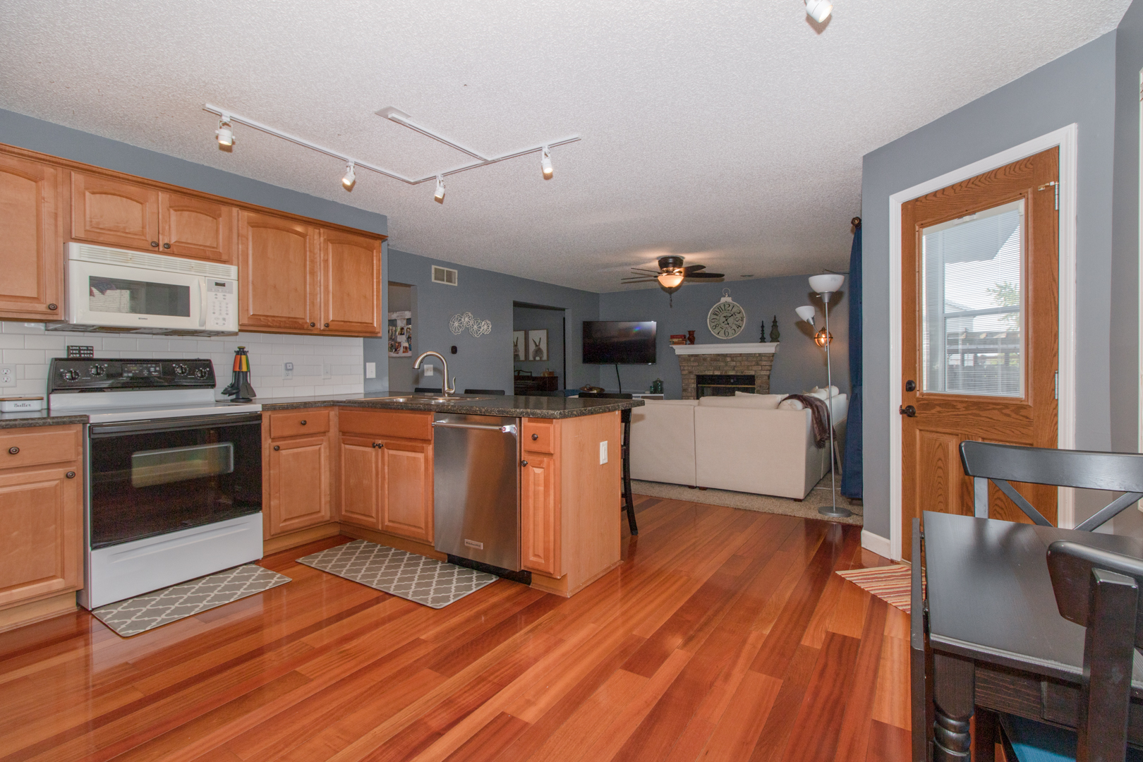 8 Holder Way Bloomington, IL 61704 - Photo 14 of 44 a kitchen with counter top space and wooden floor