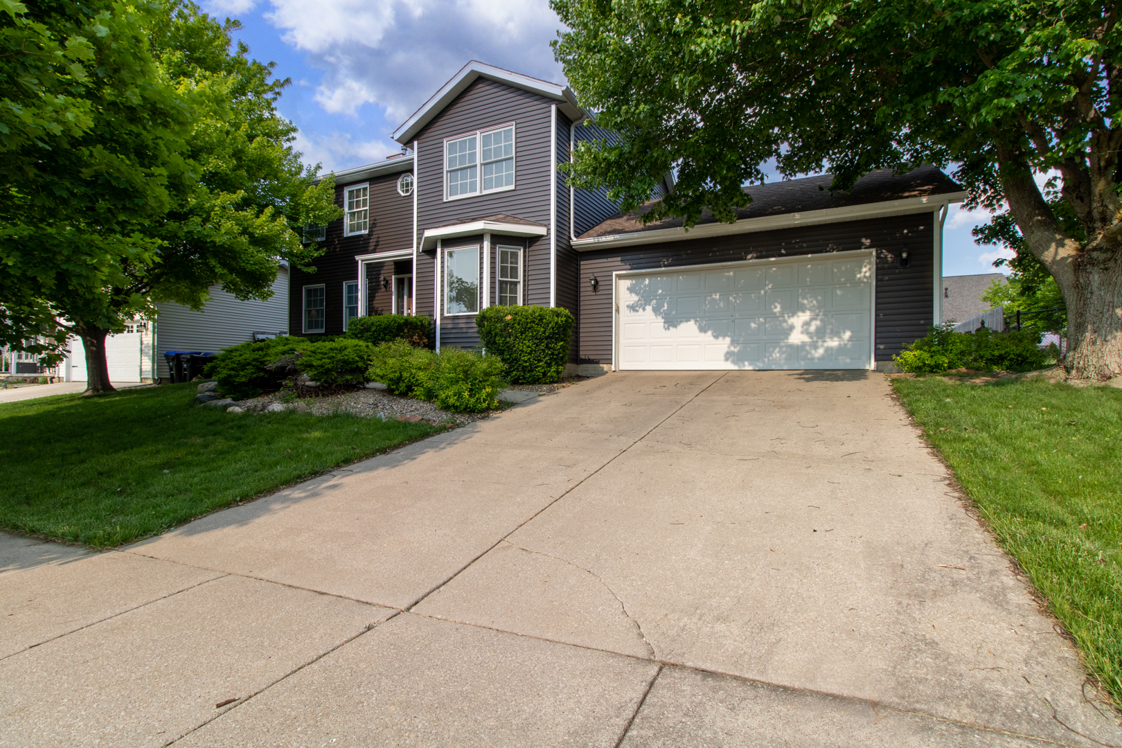 8 Holder Way Bloomington, IL 61704 - Photo 2 of 44 a front view of house with yard and green space