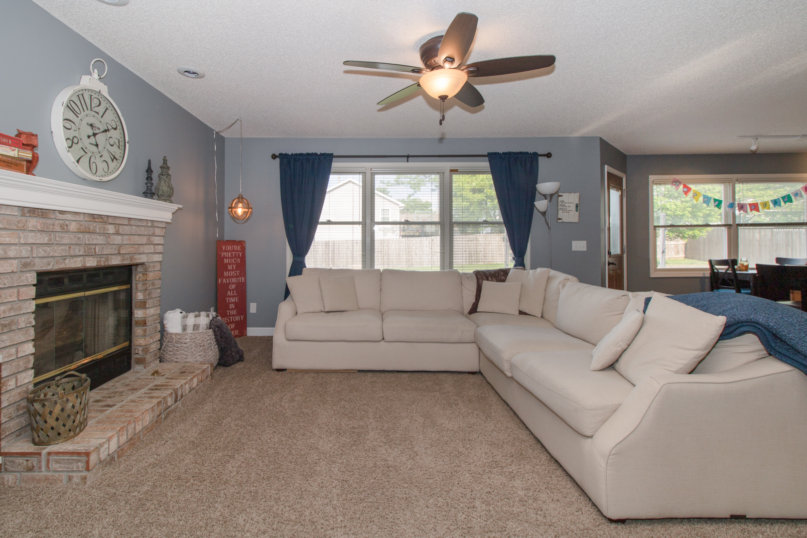 8 Holder Way Bloomington, IL 61704 - Photo 21 of 44 a living room with furniture a large window and a fireplace