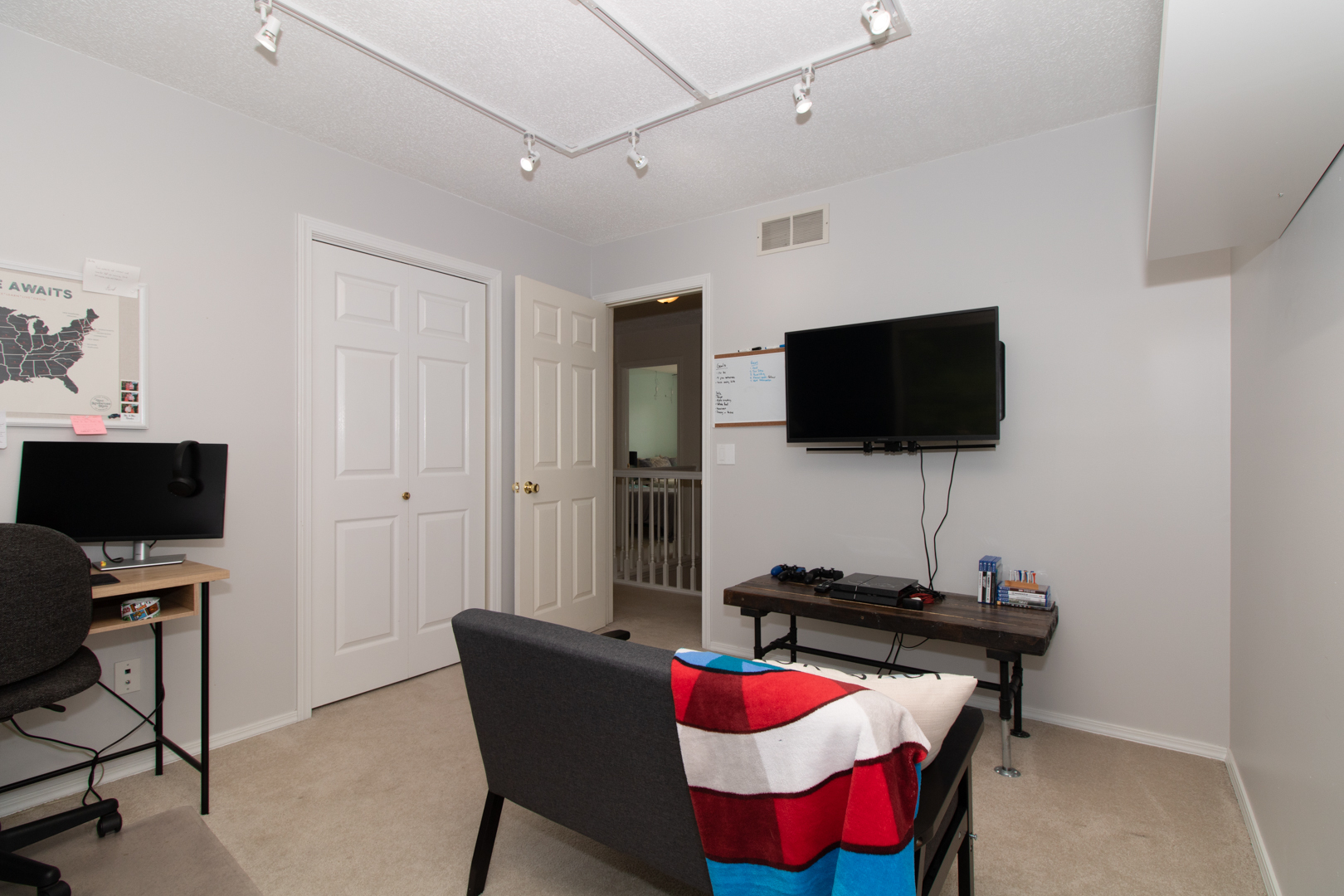 8 Holder Way Bloomington, IL 61704 - Photo 24 of 44 a living room with furniture and a flat screen tv