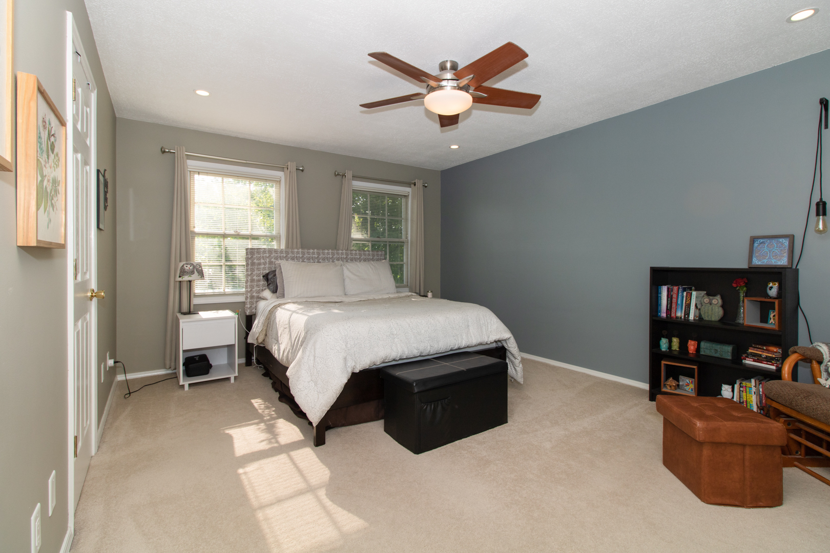 8 Holder Way Bloomington, IL 61704 - Photo 28 of 44 a bedroom with a large bed and a book shelf