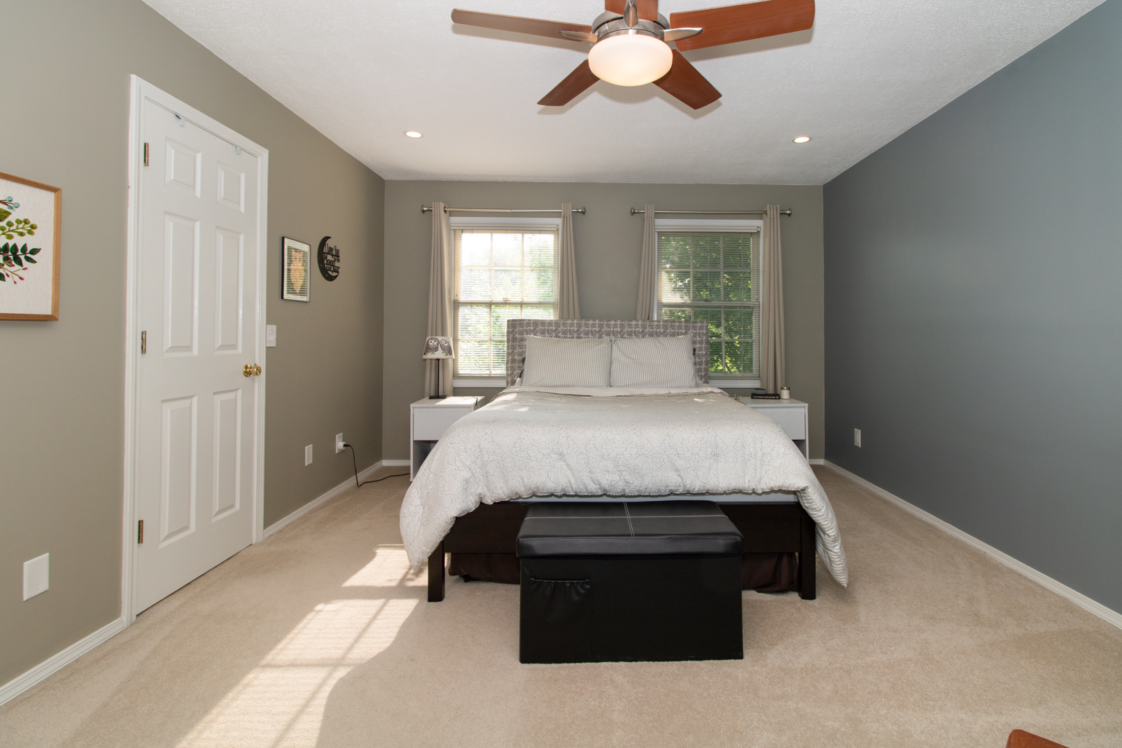 8 Holder Way Bloomington, IL 61704 - Photo 29 of 44 a bed sitting in a spacious bedroom next to a window and a chandelier