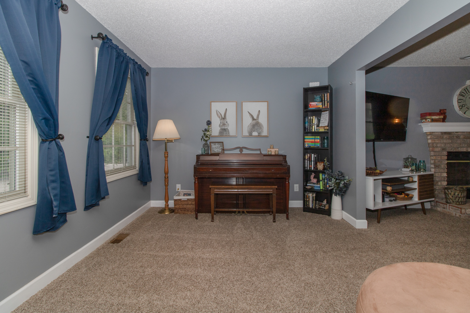 8 Holder Way Bloomington, IL 61704 - Photo 3 of 44 a room with furniture and a flat screen tv