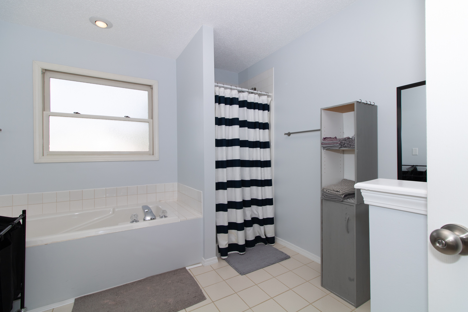 8 Holder Way Bloomington, IL 61704 - Photo 31 of 44 a bathroom with a bathtub and shower