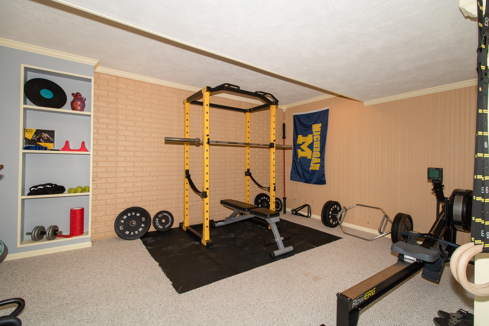 8 Holder Way Bloomington, IL 61704 - Photo 36 of 44 a room with gym equipment and a mirror