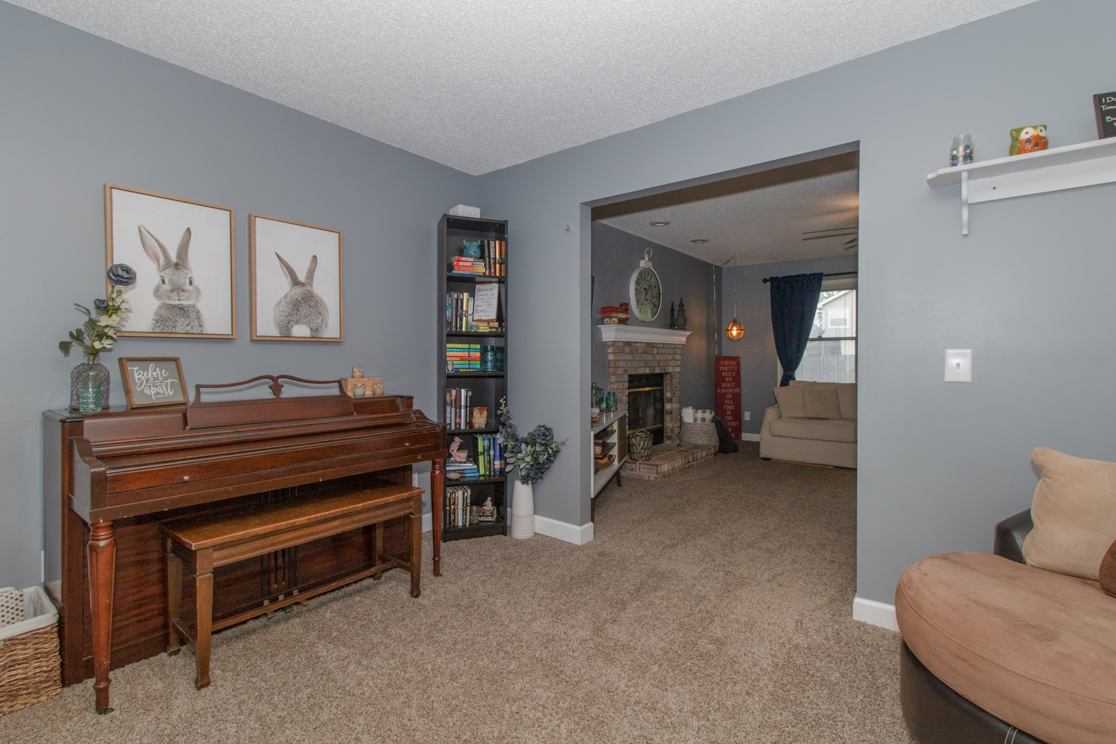 8 Holder Way Bloomington, IL 61704 - Photo 4 of 44 a bedroom with furniture and a chandelier