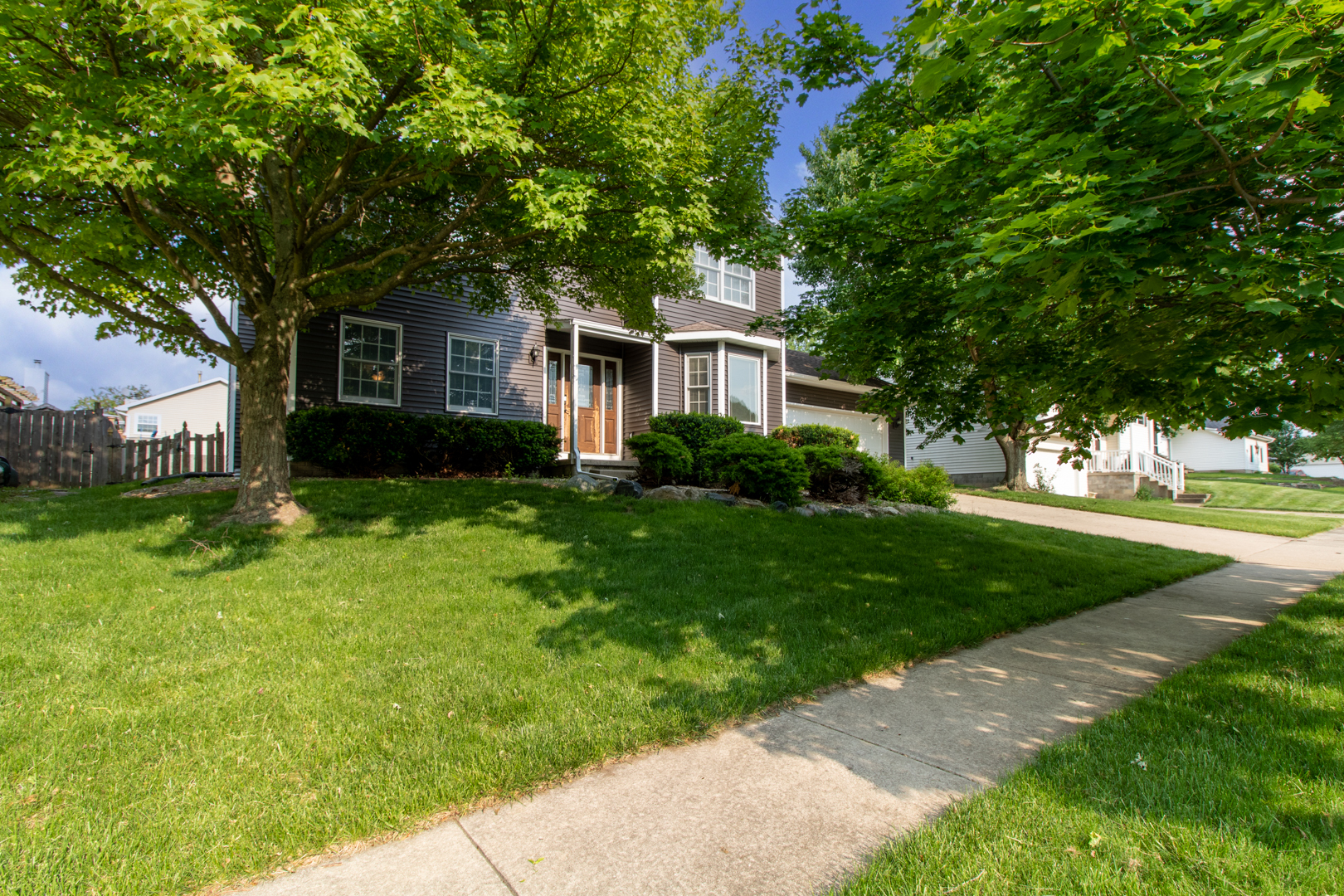 8 Holder Way Bloomington, IL 61704 - Photo 41 of 44 a front view of a house with a garden