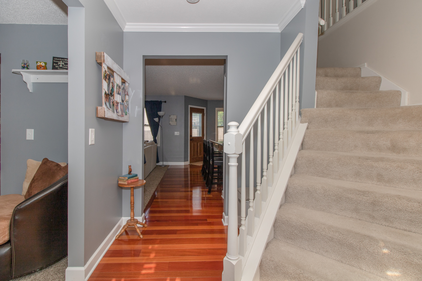 8 Holder Way Bloomington, IL 61704 - Photo 7 of 44 a hallway with wooden floor and stairs