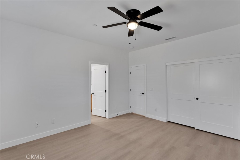 15575 Desert Star Road Apple Valley, CA 92307 - Photo 13 of 24 a view of a big room with a ceiling fan