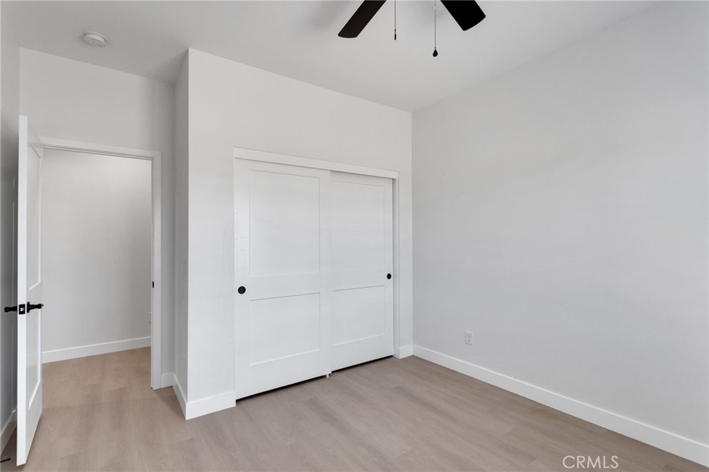 15575 Desert Star Road Apple Valley, CA 92307 - Photo 17 of 24 wooden floor in an empty room