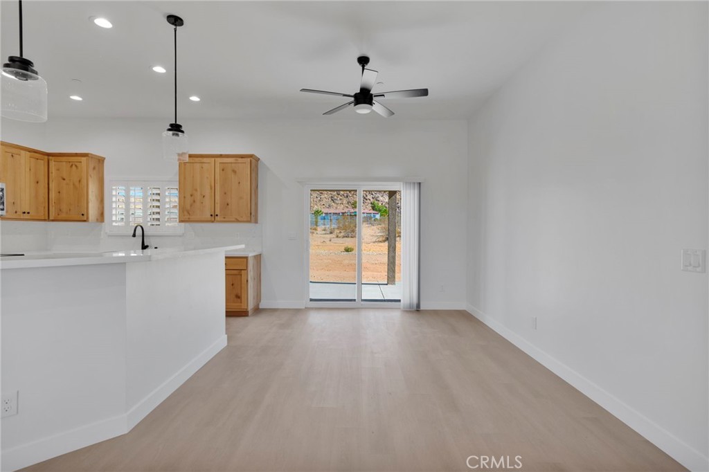 15575 Desert Star Road Apple Valley, CA 92307 - Photo 9 of 24 a view of a kitchen with a sink and a window