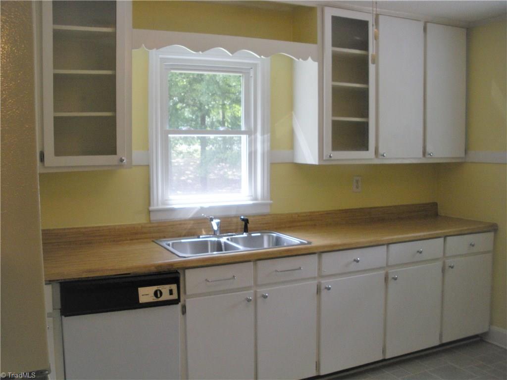 3421 Pine Valley Road High Point, NC 27265 - Photo 14 of 14 Kitchen has great counterspace and two glass cover cabinets for lots of character.