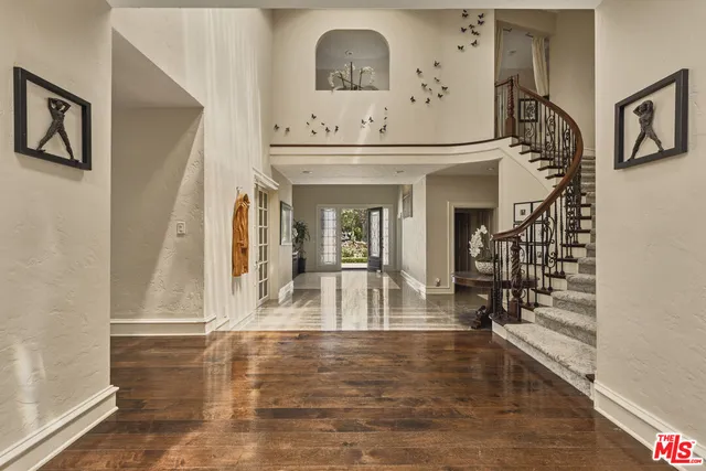 a view of living room with furniture and wooden floor