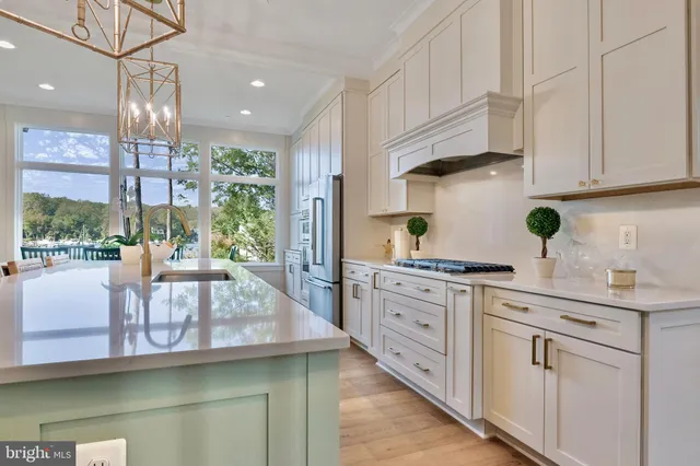 a kitchen with counter top space and living room