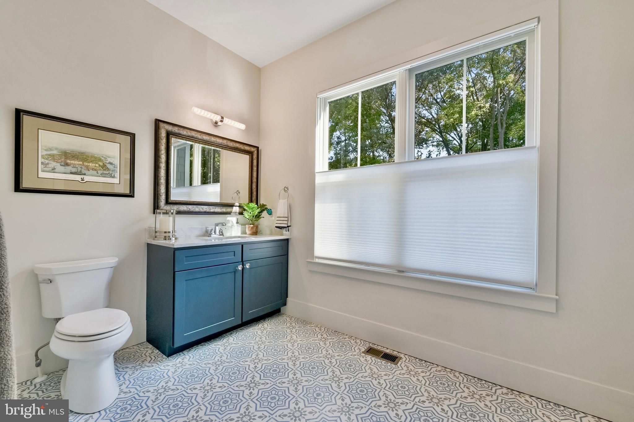 175 Tucker Court Friendship, MD 20758 - Photo 23 of 36 a bathroom with a toilet sink and mirror