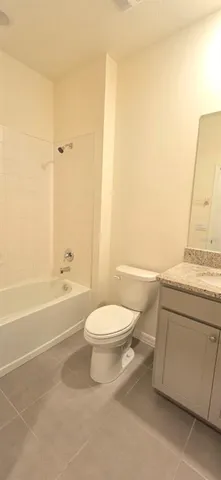 a bathroom with a toilet a sink and bathtub