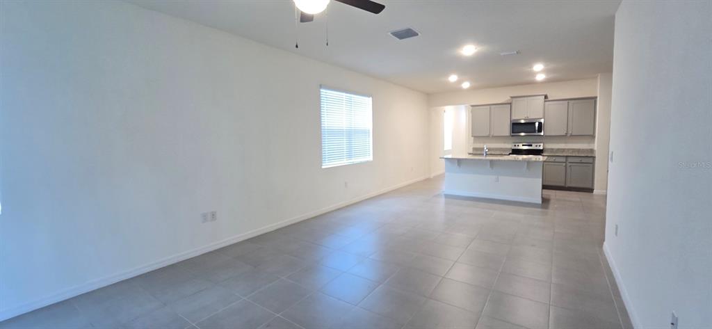 5530 Northwest 40th Loop Ocala, FL 34482 - Photo 4 of 14 a view of kitchen with sink and microwave