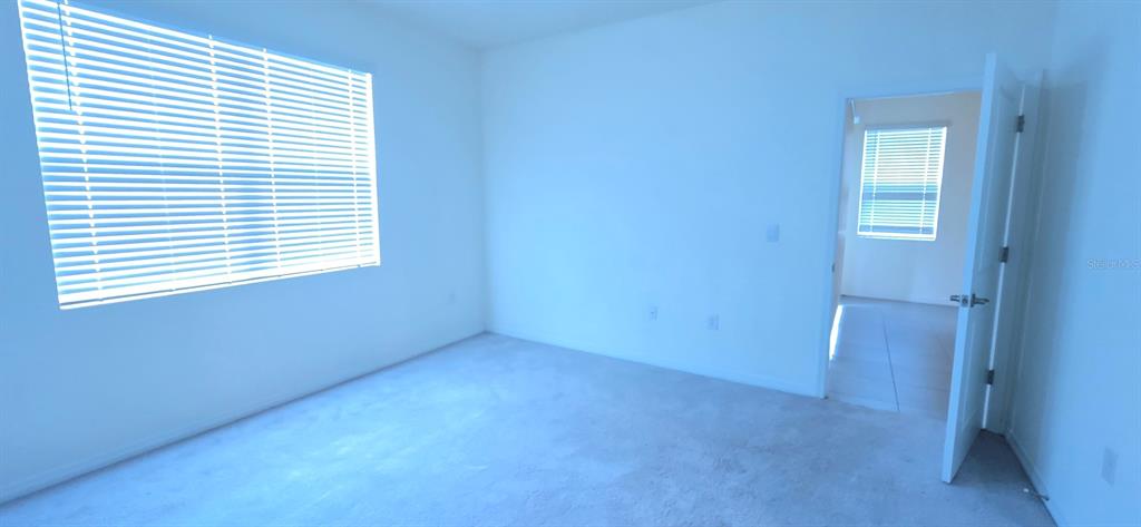 5530 Northwest 40th Loop Ocala, FL 34482 - Photo 10 of 14 an empty room with a window