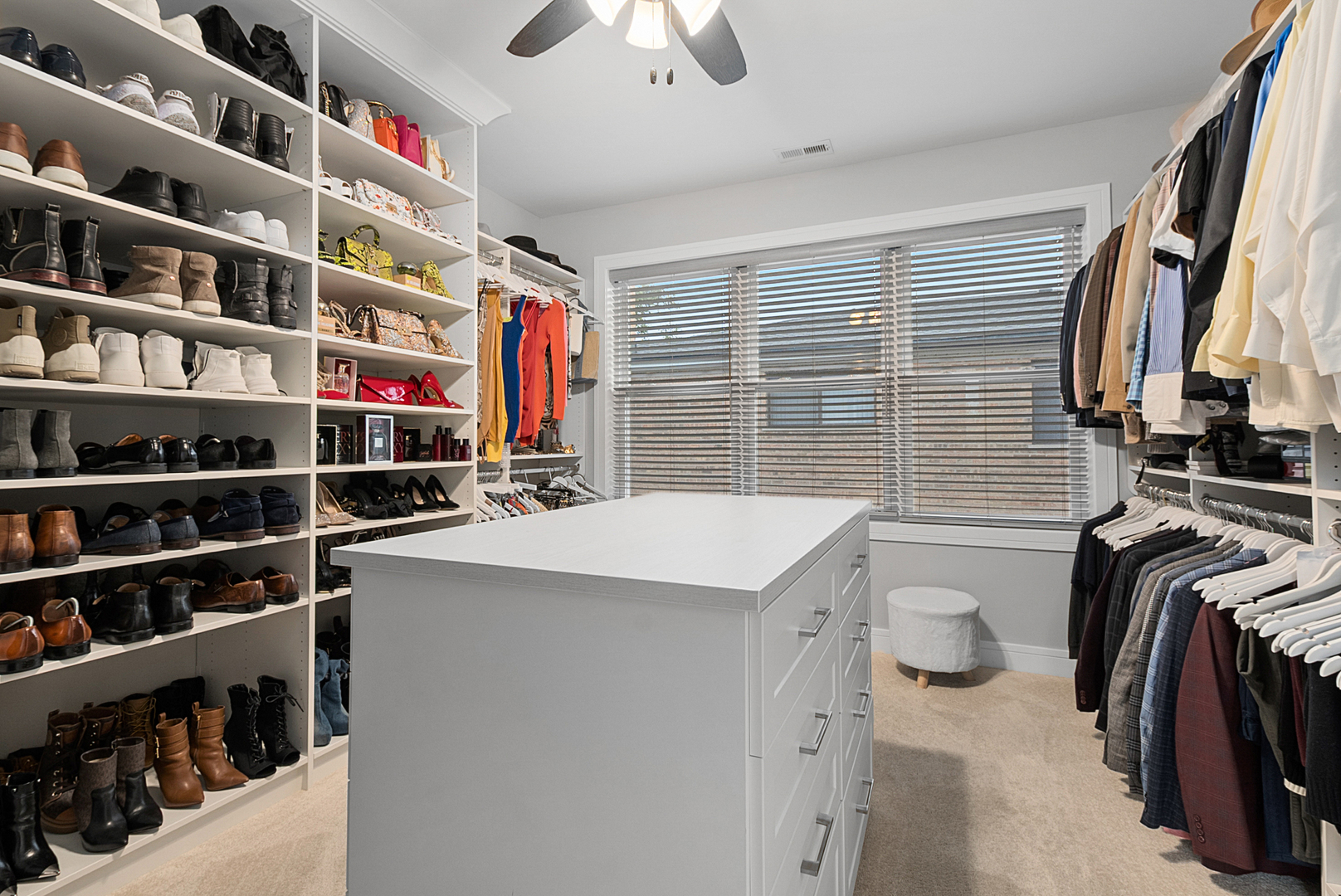 7727 South Roberts Road Bridgeview, IL 60455 - Photo 20 of 36 a view of walk in closet with clothes and shoes