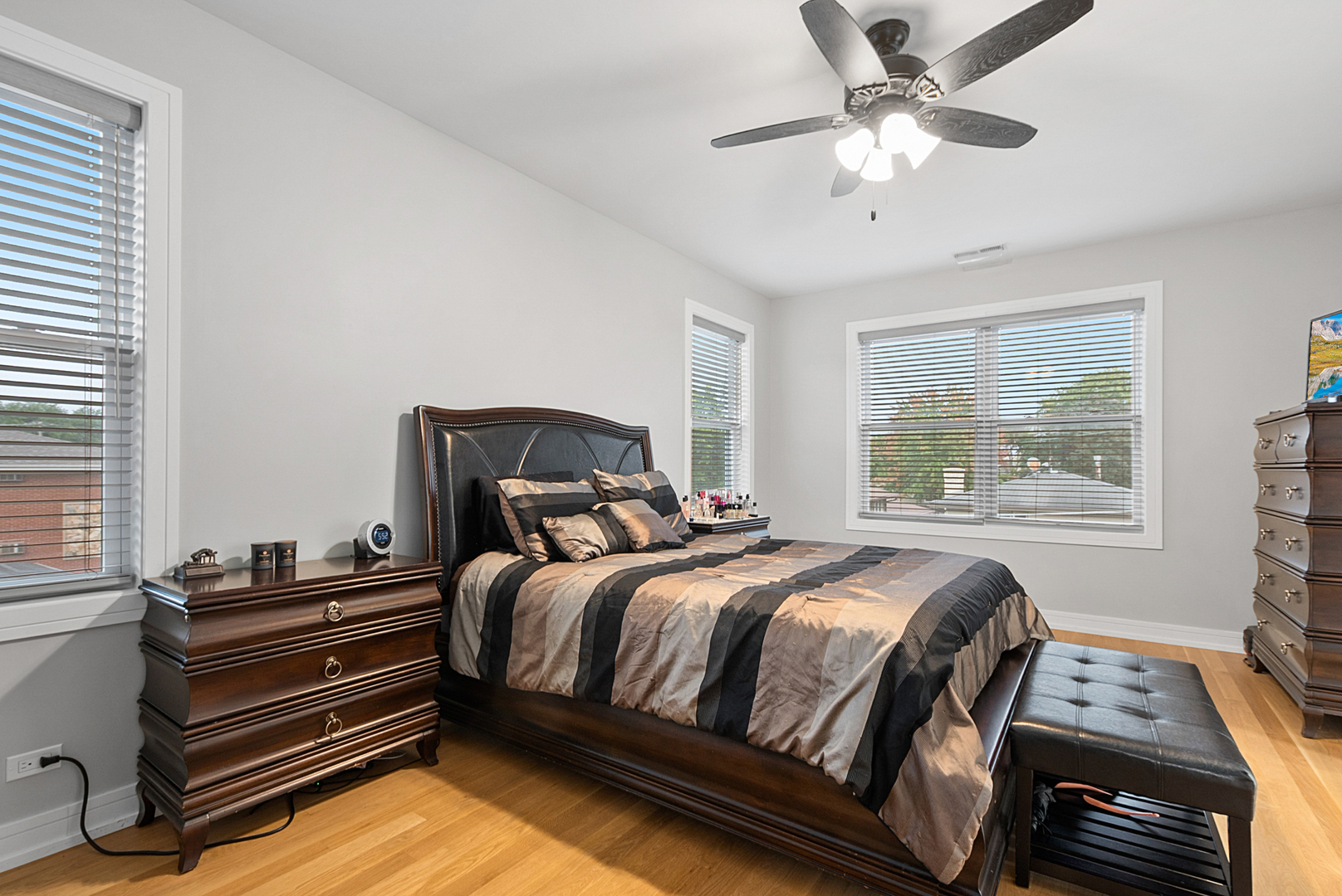 7727 South Roberts Road Bridgeview, IL 60455 - Photo 21 of 36 a bedroom with a bed next to a window