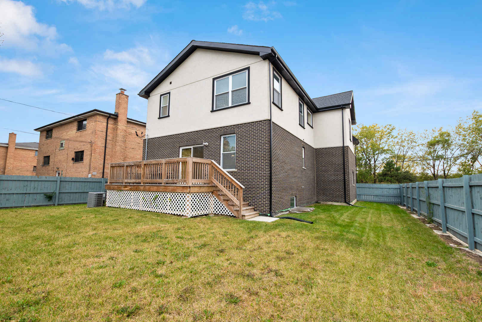 7727 South Roberts Road Bridgeview, IL 60455 - Photo 33 of 36 a view of a house with a big yard and a large tree