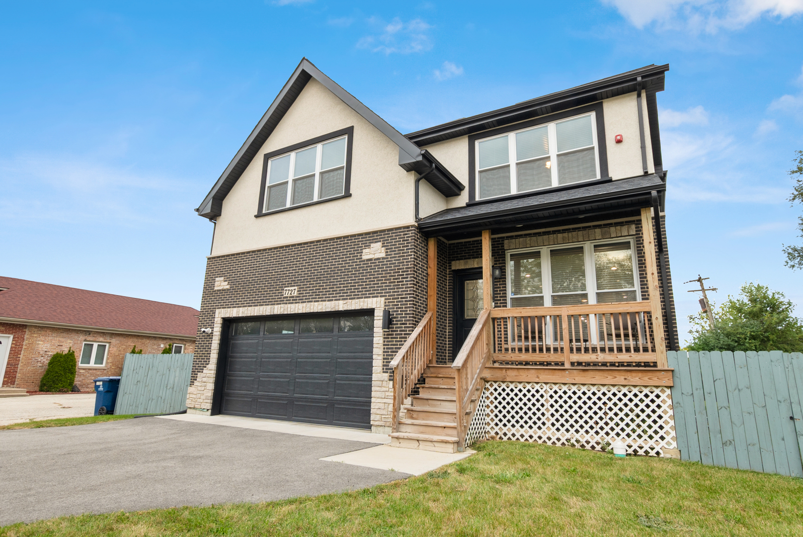 7727 South Roberts Road Bridgeview, IL 60455 - Photo 4 of 36 a front view of a house with a yard