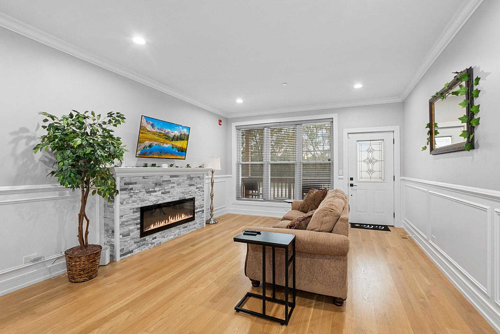7727 South Roberts Road Bridgeview, IL 60455 - Photo 6 of 36 a living room with furniture and a fireplace