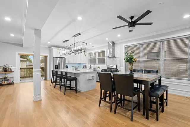 a view of a dining room with furniture and wooden floor