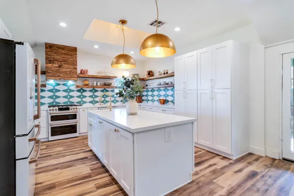 a view of a balcony with wooden floor