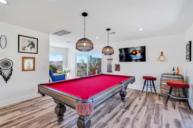 a view of a backyard with sitting area