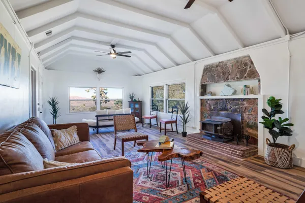 a kitchen with stainless steel appliances kitchen island granite countertop a sink and a stove