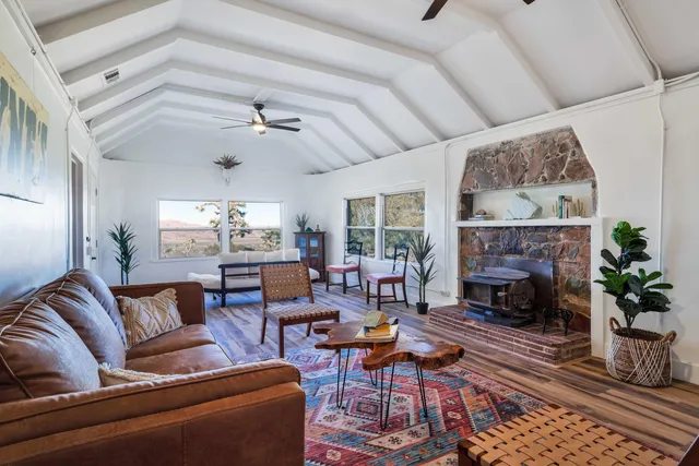 a kitchen with stainless steel appliances kitchen island granite countertop a sink and a stove