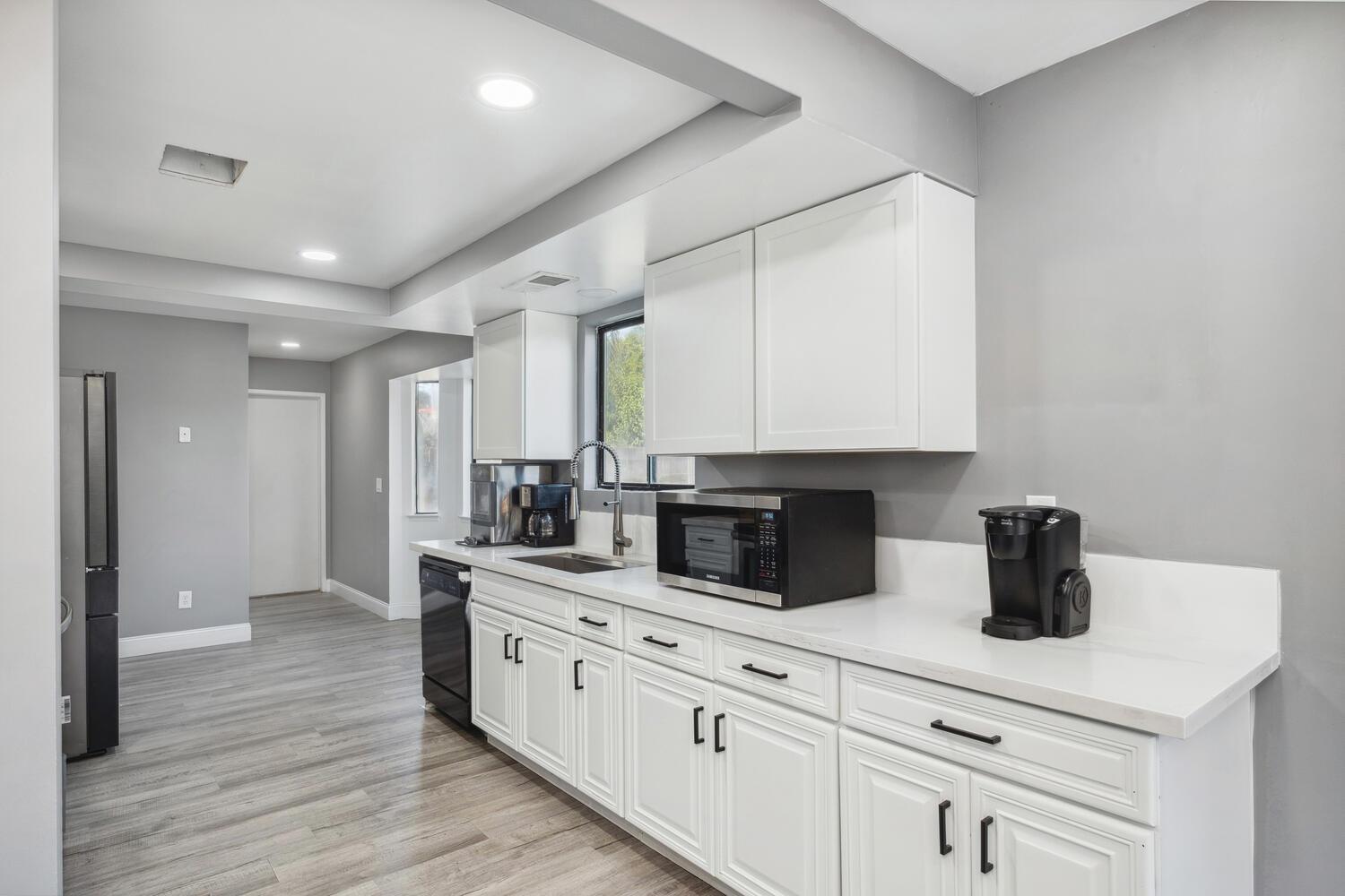 133 Armstrong Avenue Clovis, CA 93611 - Photo 11 of 25 a kitchen with stainless steel appliances a sink dishwasher stove refrigerator and cabinets