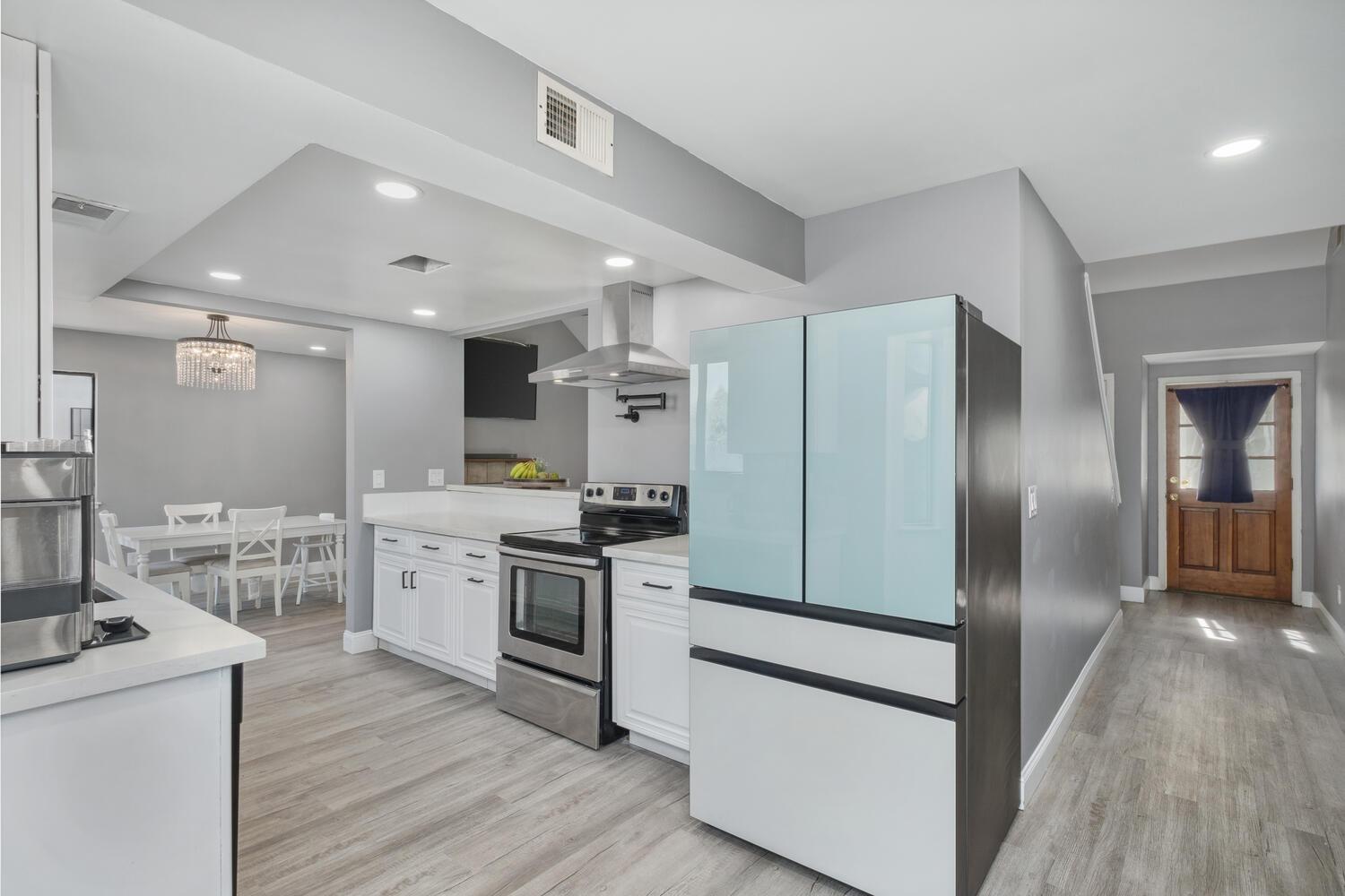 133 Armstrong Avenue Clovis, CA 93611 - Photo 14 of 25 a kitchen with stainless steel appliances a refrigerator stove and sink