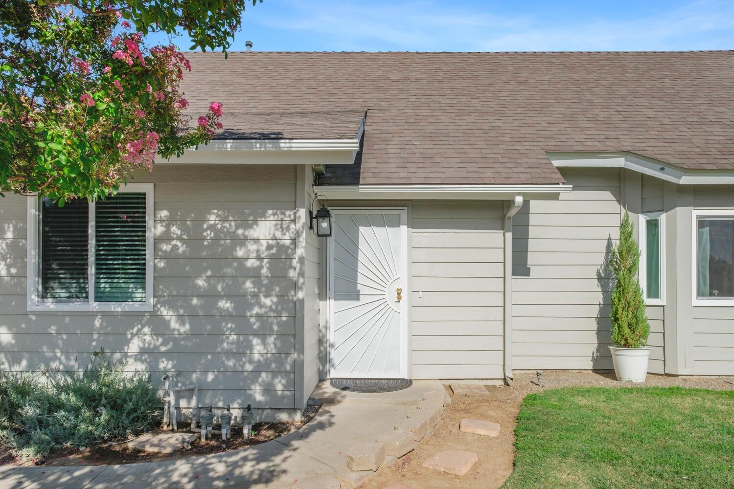 133 Armstrong Avenue Clovis, CA 93611 - Photo 3 of 25 a front view of a house with a yard