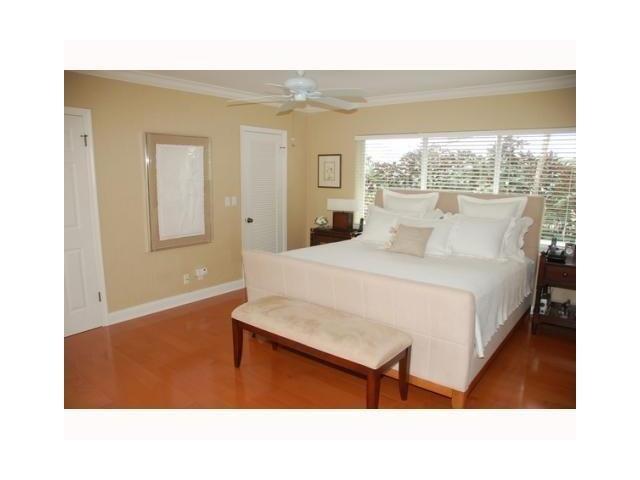 1290 Cypress Way Boca Raton, FL 33486 - Photo 11 of 15 a living room with a bed furniture and a large window