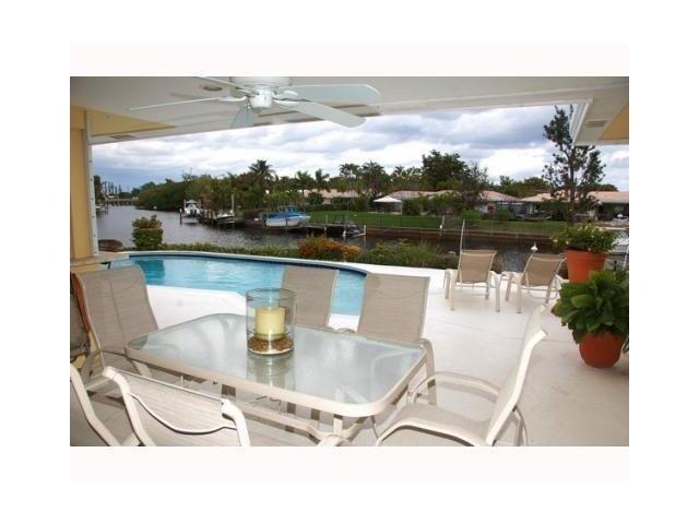 1290 Cypress Way Boca Raton, FL 33486 - Photo 13 of 15 a dining room with furniture and a floor to ceiling window