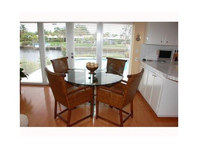 1290 Cypress Way Boca Raton, FL 33486 - Photo 4 of 15 a kitchen view with a dining table chairs and a window