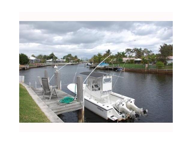 1290 Cypress Way Boca Raton, FL 33486 - Photo 6 of 15 a picture of a person on a lake
