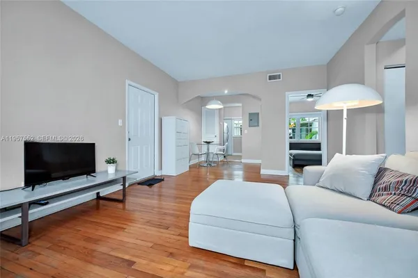 a living room with furniture and a flat screen tv