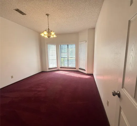 a view of an entryway with a chandelier