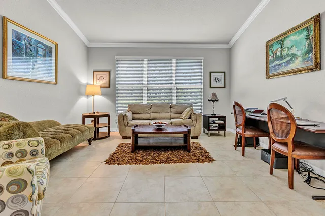 a living room with furniture and a rug