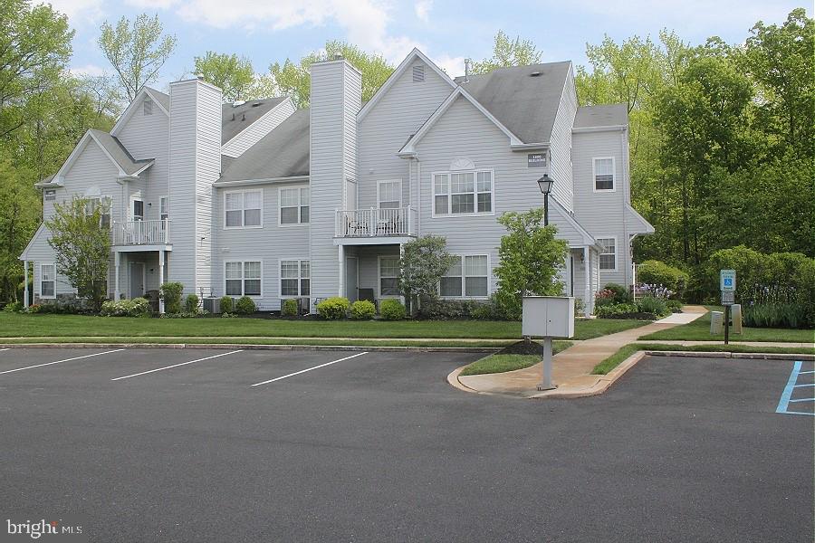 1603 Squirrel Road Marlton, NJ 08053 - Photo 1 of 29 a view of a white house with a swimming pool table and chairs