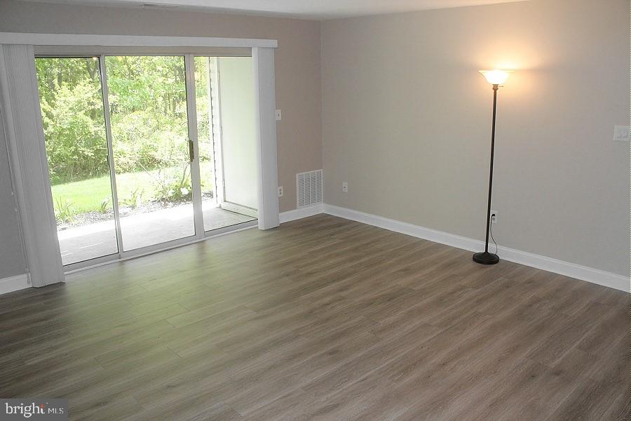 1603 Squirrel Road Marlton, NJ 08053 - Photo 11 of 29 a view of an empty room with wooden floor and a window